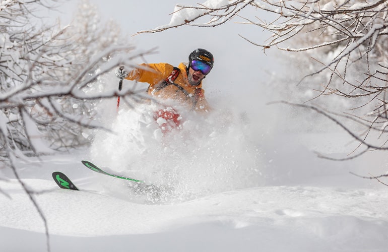 Skier on the Snowy Mountains during his Holiday in Livigno